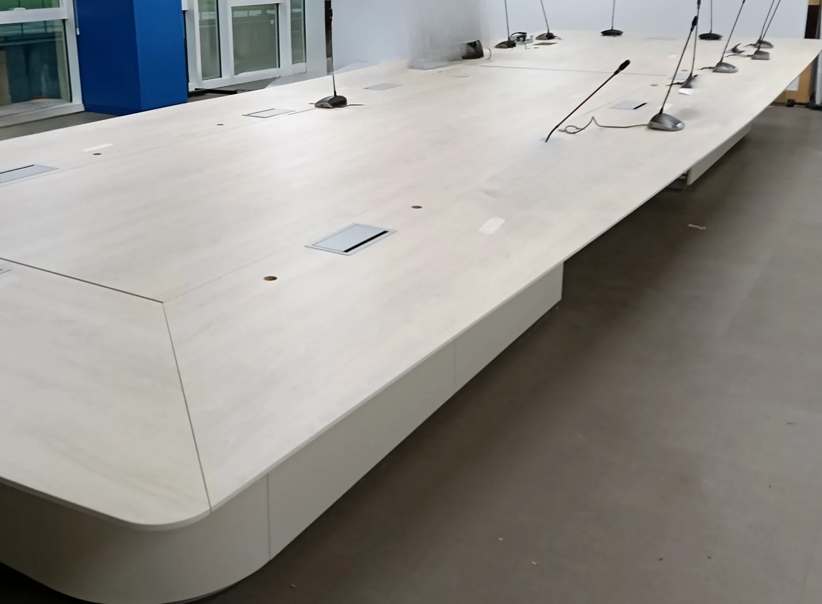 Large boardroom with a microphone at every seat
