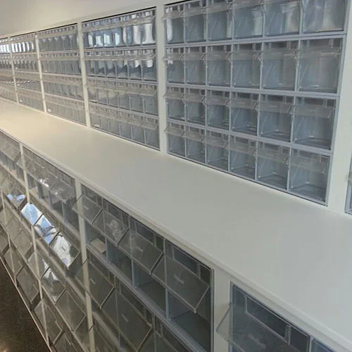 Continuous worktop below clear bin modules