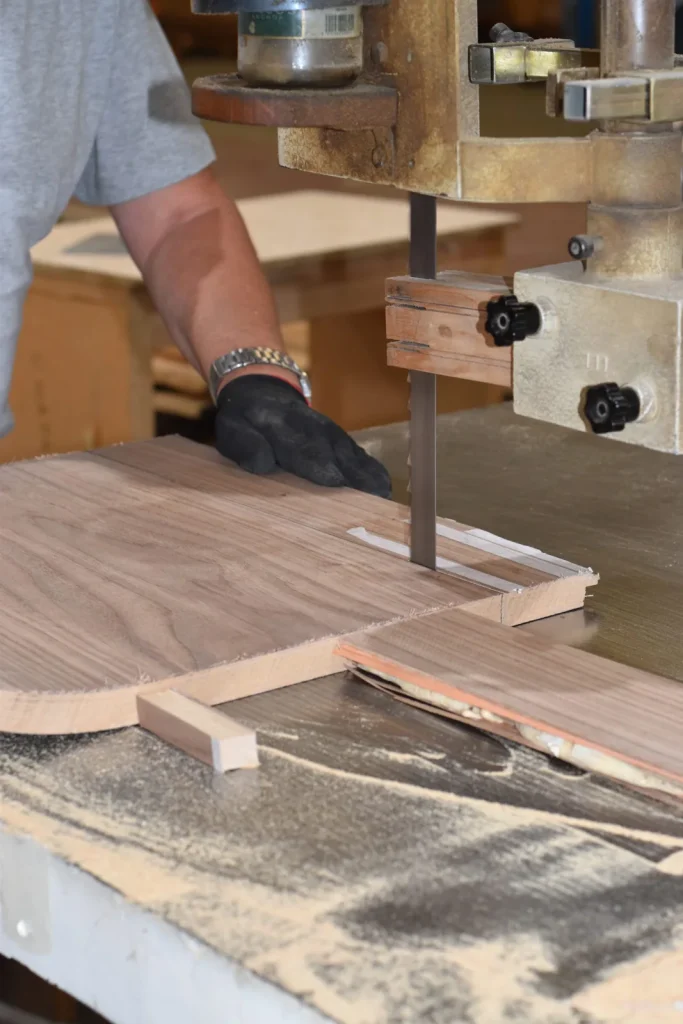 Cabinetmaker hand-cutting a solid wood piece